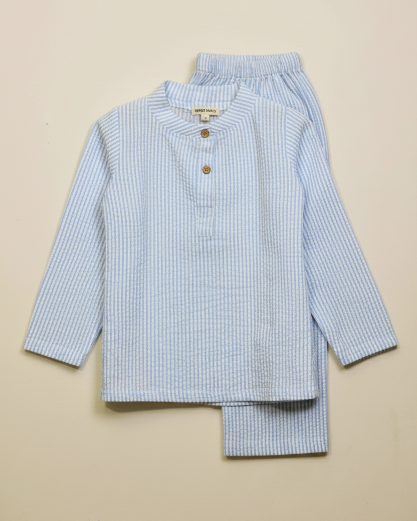 Children's blue checkered pajama set on a beige background